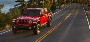 2021 Red Jeep Gladiator Driving Down Highway