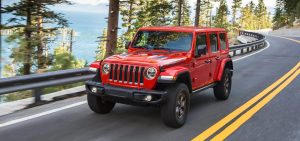 Red 2021 Jeep Wrangler Driving Down the Highway