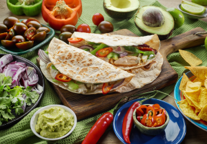 Mexican food ingredients on a wooden table.