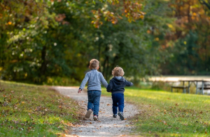 two kids playing at a park